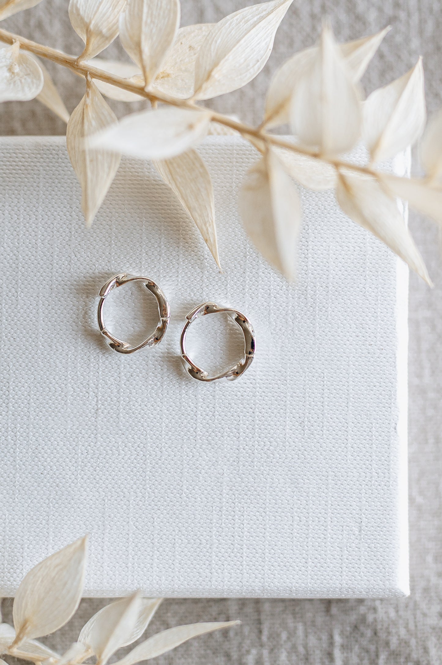 "Crave" twisted hoop earrings