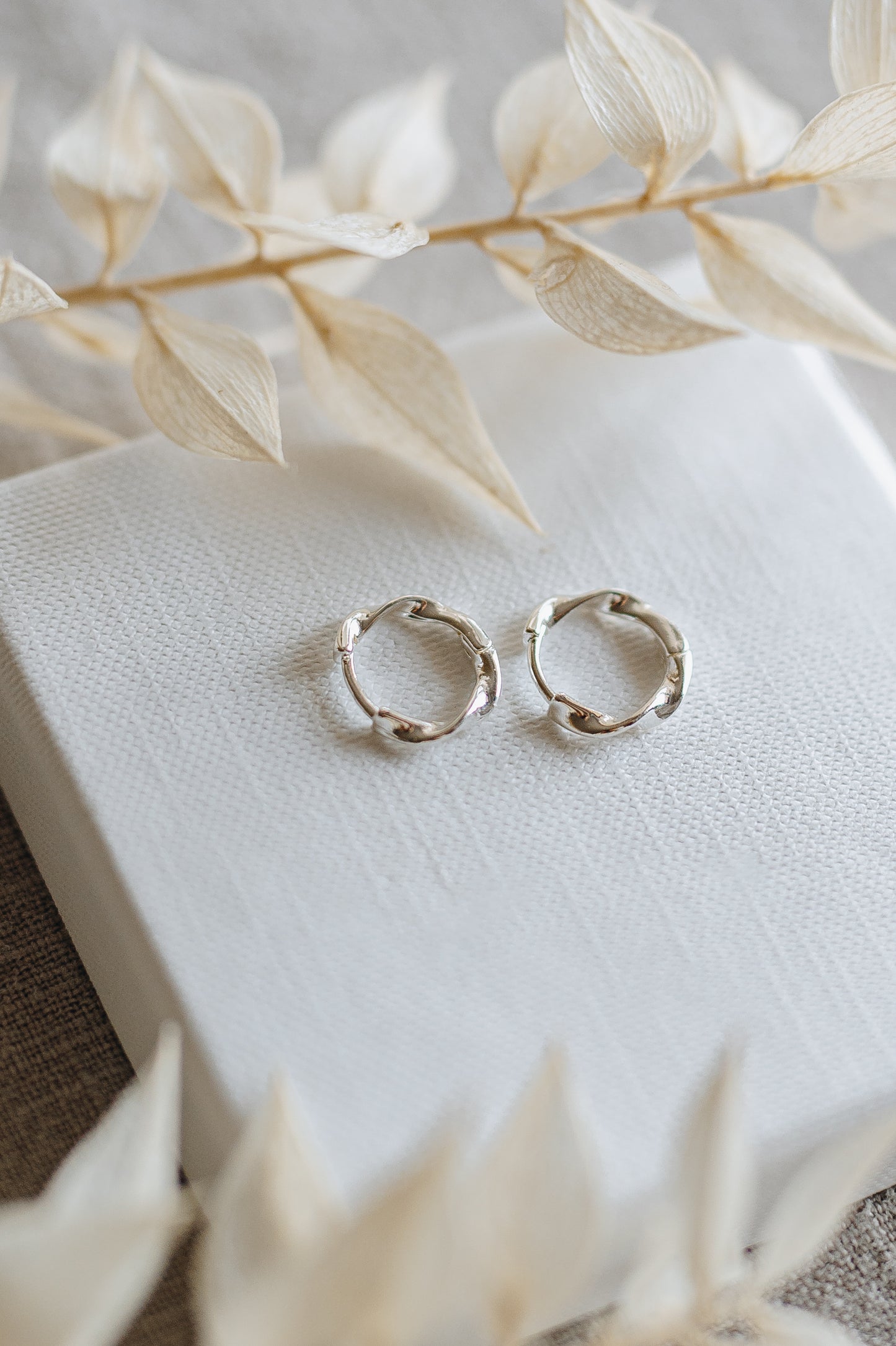 "Crave" twisted hoop earrings