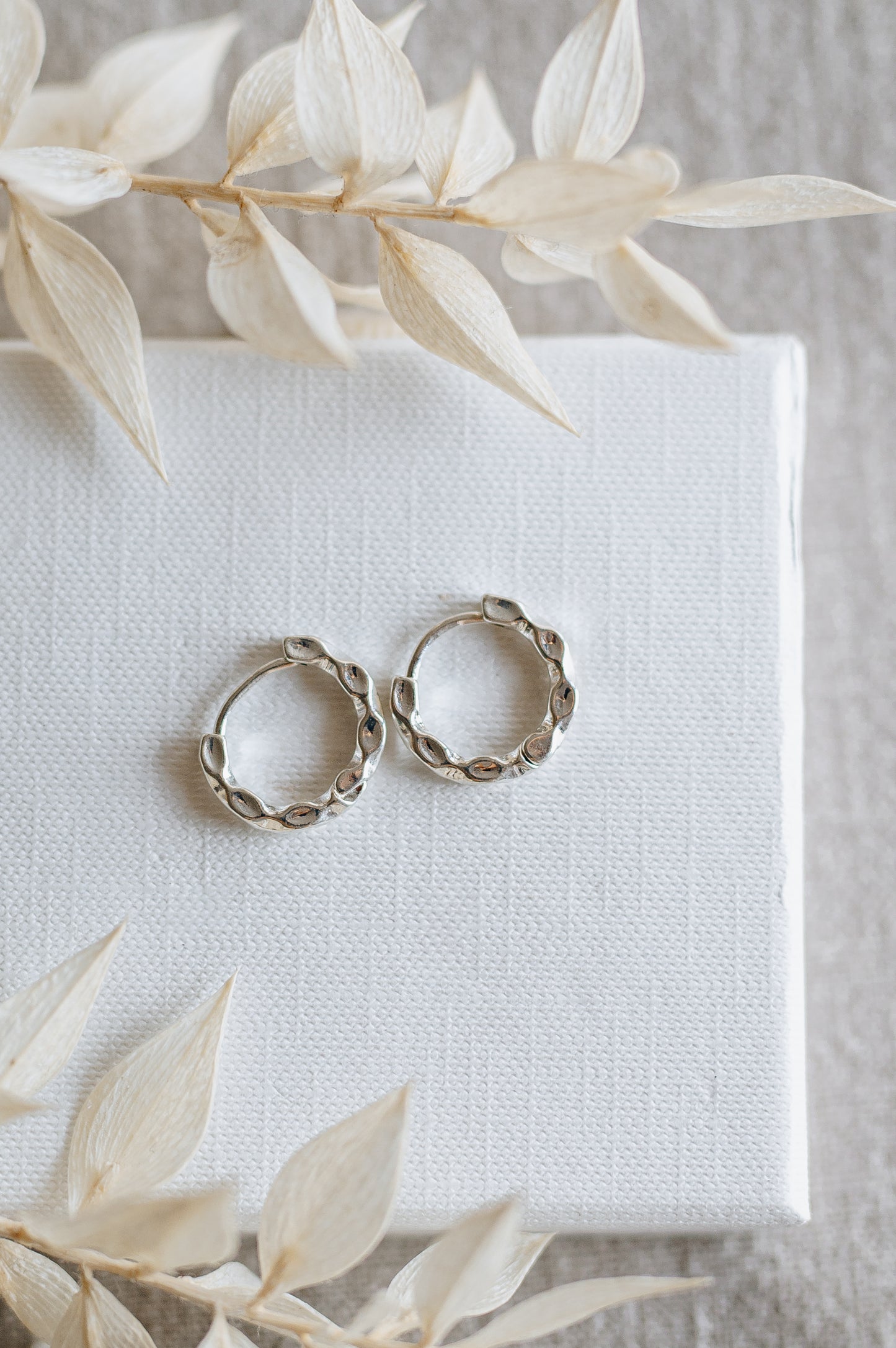 "Crave" twisted hoop earrings