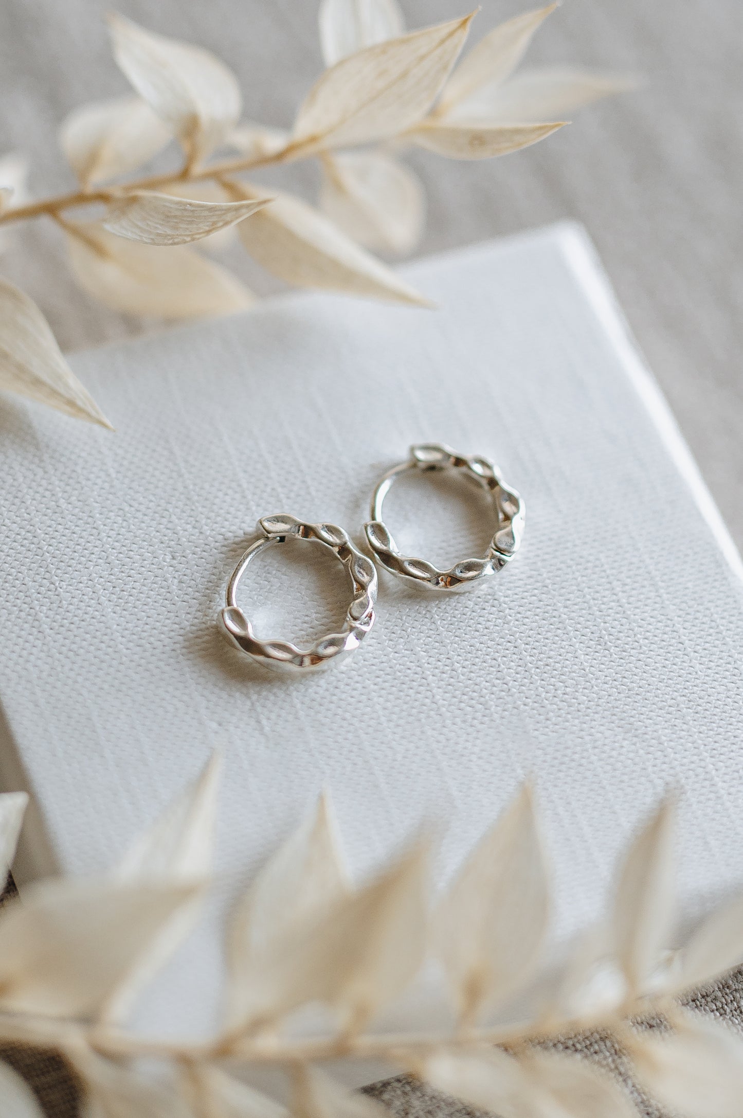 "Crave" twisted hoop earrings