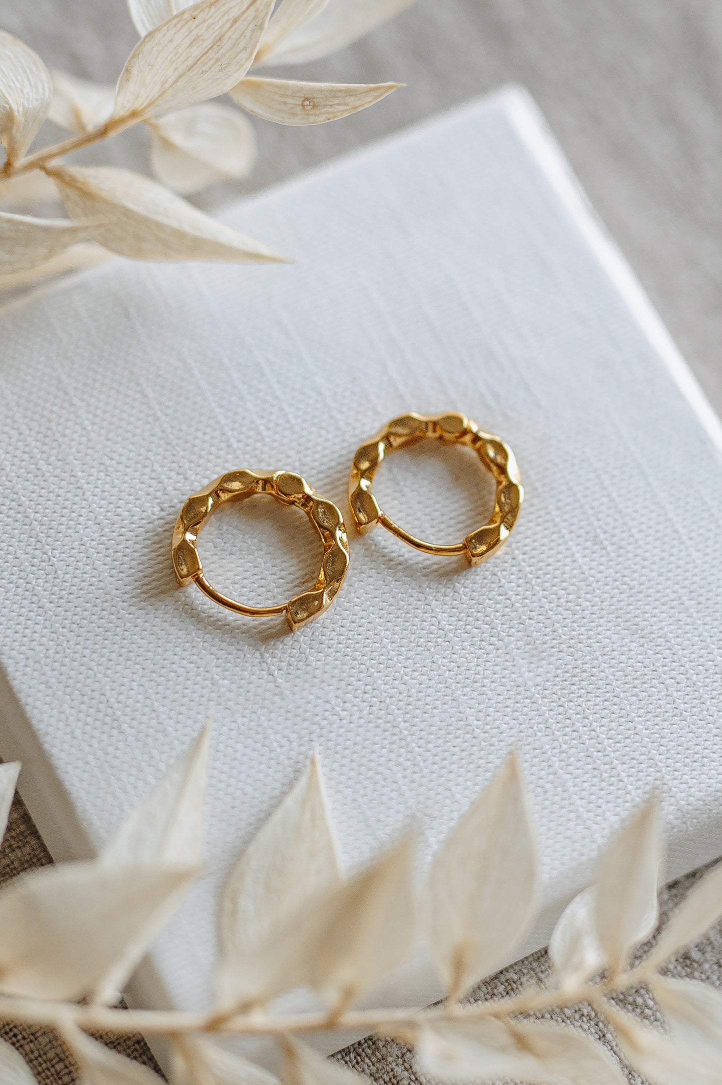 "Crave" twisted hoop earrings